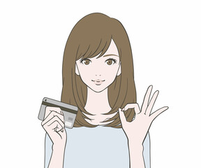 カードを持ち、OKマークをつくる女性
