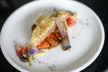 Herb Crusted Salmon. Grilled salmon steak with lemon mushroom and potatoes