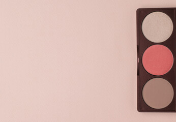 Face shadows in pastel colors on a beige background. Flat lay.