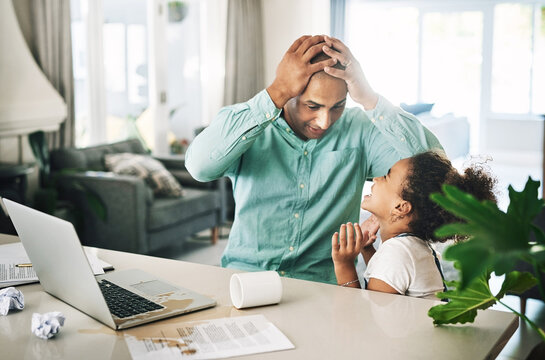 What Are We Going To Tell Mom. Shot Of A Young Businessman And A Child Looking Shocked At Home.