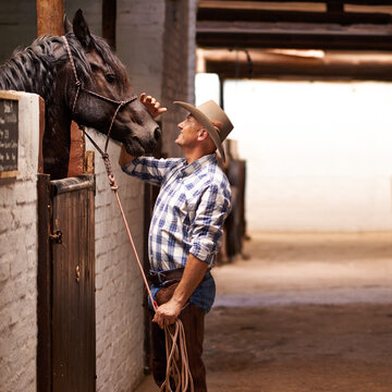 Its a cowboys life. Shot of a cowboy on a farm.
