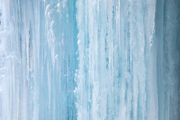 Icy, frozen textured icicle wall for background