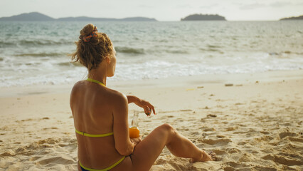 Lonely woman in swimwear on the beach drinks alcohol. Parting love, divorce from husband, bad failed relationships. Sadness, unhappy, worried woman, longing loneliness depression melancholia sorrow.