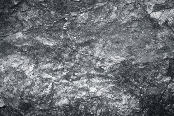 Fototapeta na wymiar Grey granite stone wall texture with natural patterns on background
