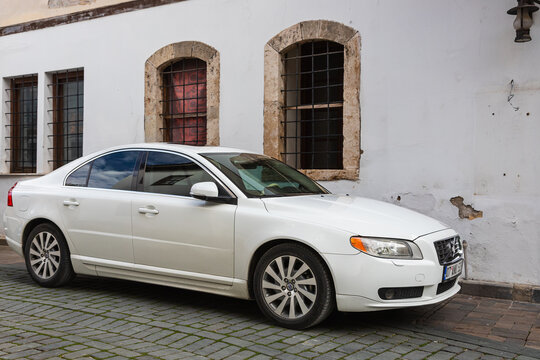 Side; Turkey &ndash; February 20 2022:  white Volve s60   is parked  on the street on a warm  day against the backdrop of a buildung
