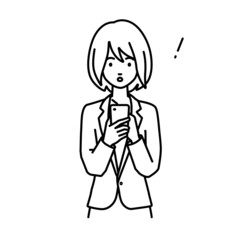 立ってスマートフォンを操作して何かに気づいて驚いたスーツの女性