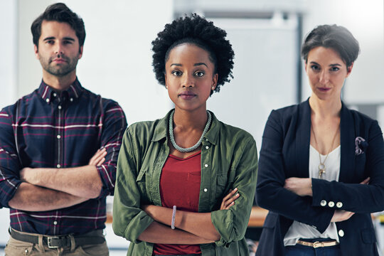 We Take Pride In Our Teams Work Ethic. Portrait Of A Group Of Businesspeople Standing With Their Arms Folded In A Modern Office.