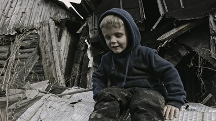 A child is crying^ playing in the ruins
