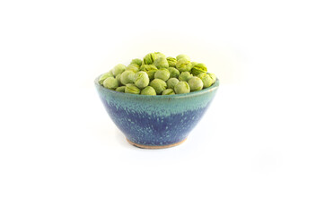 Freeze Dried Peas in Blue Pottery Bowl Isolated on White