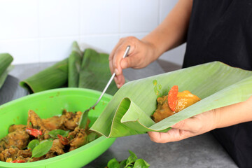 Wrapping Pepes Ayam, Steam Chiken with Chilli and Herbs, Nasi Bungkus