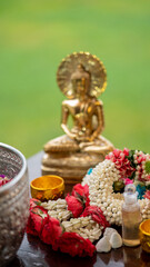 Flower garlands, water bowls, perfume and white clay filler for Buddha bathing ceremony on important religious days for Buddhists, New Year's and Songkran Festivals for Asians.