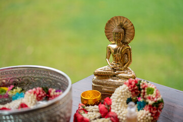 Flower garlands, water bowls, perfume and white clay filler for Buddha bathing ceremony on important religious days for Buddhists, New Year's and Songkran Festivals for Asians.