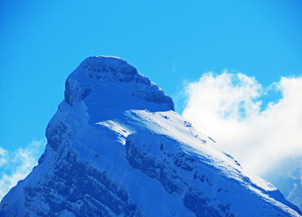 Fototapeta na wymiar Snow-capped alpine peak Zuestoll (2234 m) in the Churfirsten mountain range, between the Toggenburg region and Lake Walensee or Lake Walenstadt - Obertoggenburg, Switzerland (Schweiz)