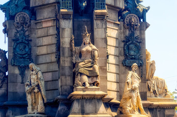 Various statues as symbolic details at Columbus Memorial in Barcelona, Spain.