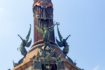 Fototapeta na wymiar Various statues as symbolic details at Columbus Memorial in Barcelona, Spain.
