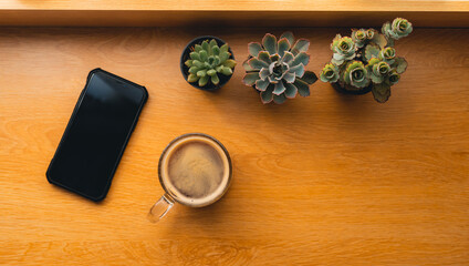 Coffee Morning,Coffee in a mug on a wooden table with a notebook