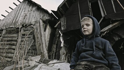 A child is crying^ playing in the ruins