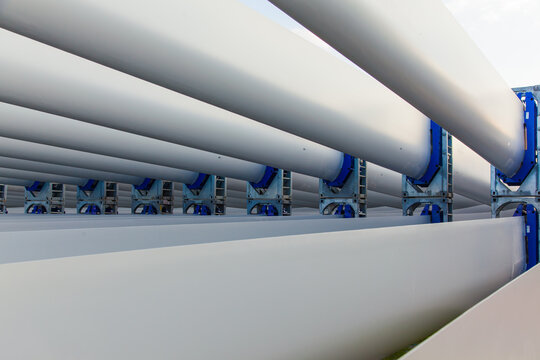 The blades of the wind stations are fixed and piled on the pier before departure from the city of Izmir Turkey.
