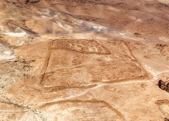 Remains of ancient Roman military camp located in desert at Masada National Park in Israel. 