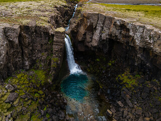 Beautiful aerial view of the magnificent Folaldafoss waterfall in the highlands of Iceland