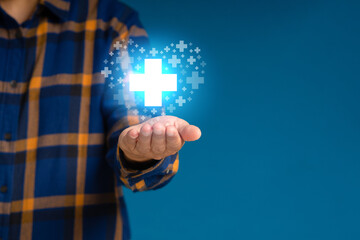 Virtual medical icons on the palm businessman against a blue background