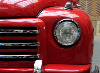 Car headlight with glass surface