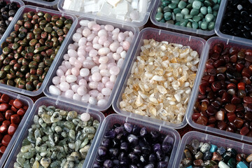 colorful ornamental stones in different containers
