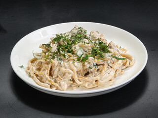 Spaghetti with cream sauce and herbs