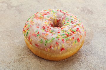 Sweet glazed vanilla donut with icing