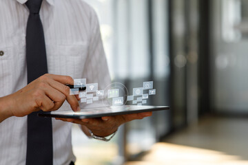 Close up of Businessman using tablet analyzing sales data and economic growth graph chart. Business strategy. Abstract icon. Digital marketing.