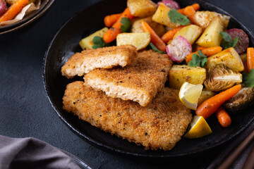 Vegan Plant based fish with crispy batter and roasted vegetables
