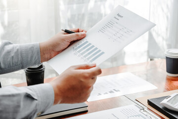 Business team meeting Strategy Planning with new startup project plan Finance and Economy Graph with laptop successful teamwork