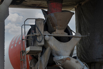 Concrete mixer truck loads concrete at the factory. Transportation of concrete to the construction...