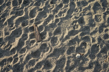 Fototapeta na wymiar 砂浜　砂　模様　抽象　穏やかな　