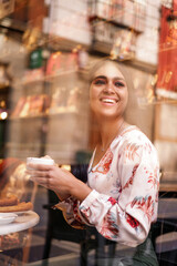 pretty indian woman drinking coffee and having fun