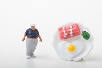 miniature figurine of a fat man with food
