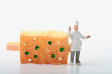 miniature figurine of chef showing some food