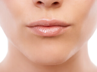 Obraz premium Gorgeous glossy lips. Cropped image of a womans lips.