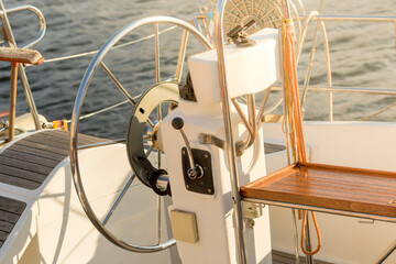 Part of a boat with a rudder and equipment for its management in sunny day. © Valerii