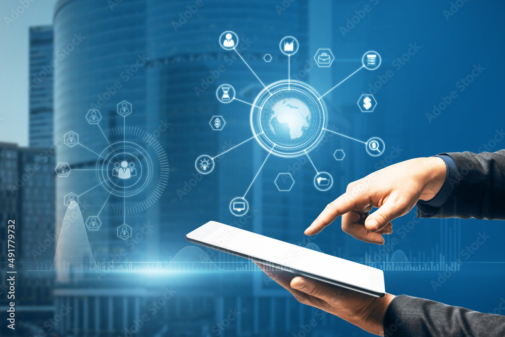 Poster close up of businessman hand pointing at tablet with abstract glowing business data and earth hologr