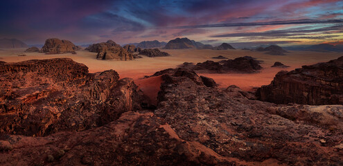 Wadi Rum desert panorama, red sand with stone and rock. Evening orange sunset in nature. Travel...