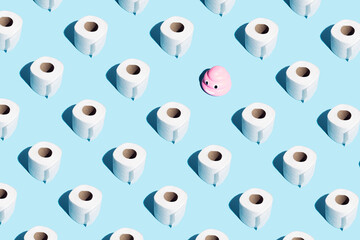 Rolls of soft toilet paper and pink poop emoticon on blue. Isometric.  High unexpected demand....
