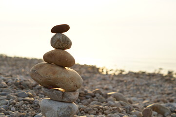 a stack of zen stones on the beach