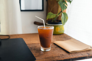 iced black coffee in a cup in the room