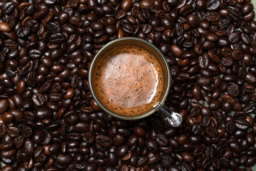 Coffee in cup close up bean texture background.