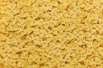farfalle pasta made from light dough, close-up. Pasta background.