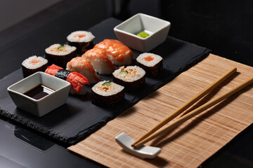 Sushi variety on a black stone