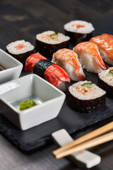Sushi variety on a black stone