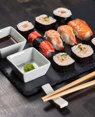 Sushi variety on a black stone