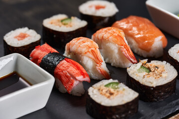 Sushi variety on a black stone